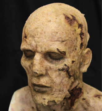 image of painted latex zombie head